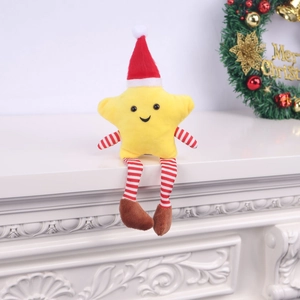 Detail of cute yellow plush Christmas star doll with striped limbs and festive Santa hat
