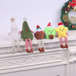 Detailed view of plush Christmas dolls with striped long legs on a white mantelpiece