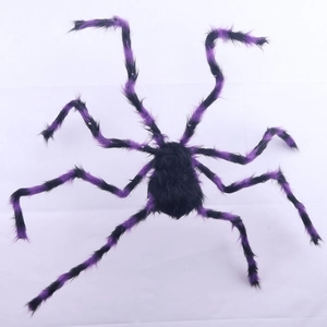 Detail of giant Halloween plush spider with black and purple striped legs for scary parties