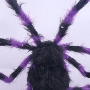 Macro shot of Halloween glowing spider with purple fur and LED lights on flexible legs