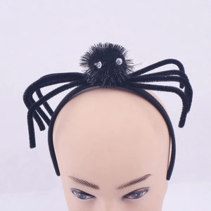 Close-up of black plush Halloween spider headband with adjustable legs on a model