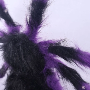 Detailed macro shot of purple and black plush spider legs with integrated LED lights