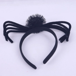 Detail shot of the plush black spider headband with flexible legs for Halloween parties