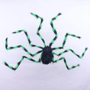 Close-up of Halloween spider prop with black plush body and green striped legs