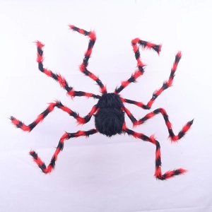 Detailed view of giant plush Halloween spider with black fur and striped red legs