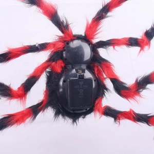 Close-up of battery compartment and switch on Halloween glowing spider decoration