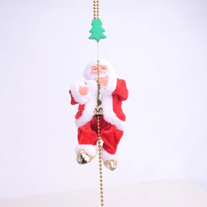 Close-up of electric climbing Santa Claus doll on golden beads with green tree topper