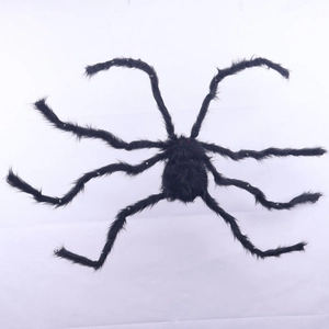 Close-up of a giant black hairy spider with glowing red eyes for Halloween decoration