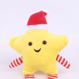 Close-up of yellow star plush doll with red Christmas hat and striped arms on white background