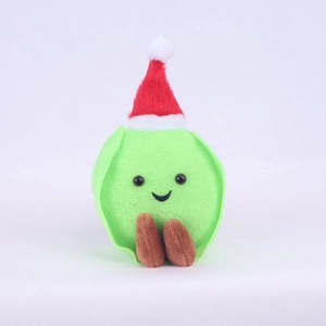 Macro detail of cute brussel sprout plush doll with festive red and white Santa hat