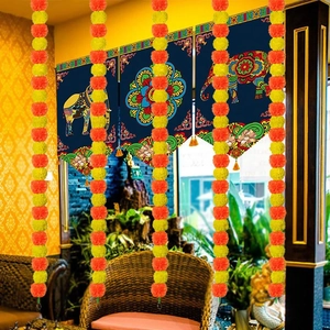 Marigold garlands and blue mandala elephant banners for Diwali and Indian wedding decor