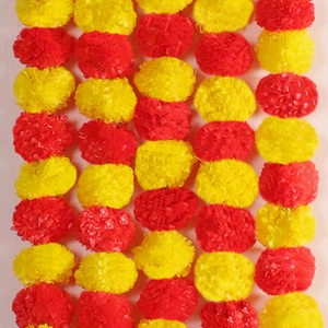 Vibrant red and yellow marigold flower garlands for Indian wedding and festival decoration