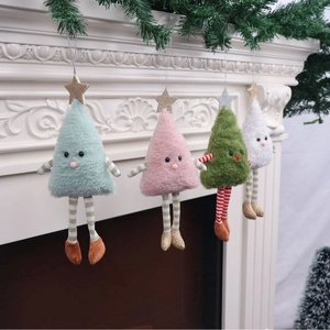 Set of four colorful plush Christmas tree hanging ornaments displayed on a fireplace