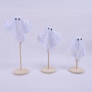 Three minimalist Halloween ghost decorations with white mesh fabric and wooden bases