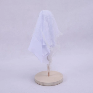 Cute Halloween ghost table ornament with white mesh fabric and a round wooden base
