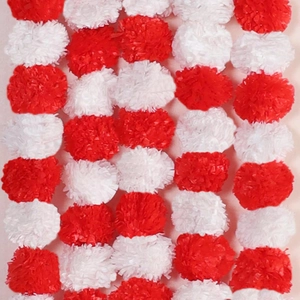 Close-up of red and white artificial marigold garland with ruffled texture for festivals