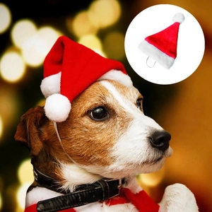 Festive red plush Christmas hat for cats and dogs with white pompom and elastic strap