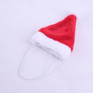 Detail of red plush mini Christmas hat with white pompom and elastic strap for pets