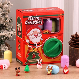 Close-up of Christmas gashapon machine with Santa Claus and snowman miniature figures