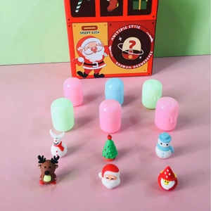 Christmas Santa gashapon machine with colorful capsules and festive toy figurines