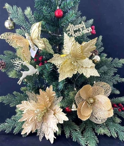 Golden Christmas tree ornaments set with glitter reindeer, poinsettia and butterfly