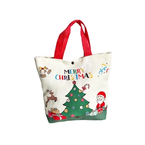 Weihnachtliche Canvas-Tasche mit Merry Christmas Aufdruck und roten Tragegriffen für Geschenke