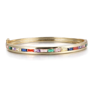 Macro detail of gold-plated rainbow zircon bracelet with secure hinge clasp closure
