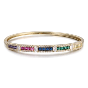 Detail of gold bangle featuring multi-colored rectangular gems and pave zircon accents
