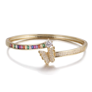 Detail of gold butterfly bracelet featuring colorful zircon stones and micro pave crystals