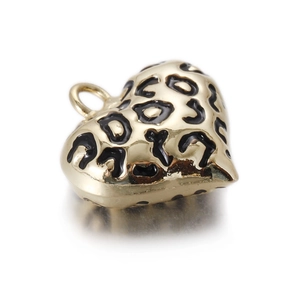 Vintage heart pendant with leopard print enamel and gold-plated finish on white background
