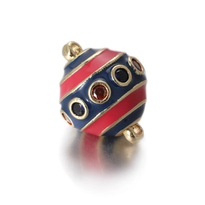 Detailed view of striped enamel egg pendant with embedded rhinestones for jewelry making