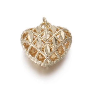 Detail of heart-shaped pendant with hollow lace design and Virgin Mary motif in gold finish