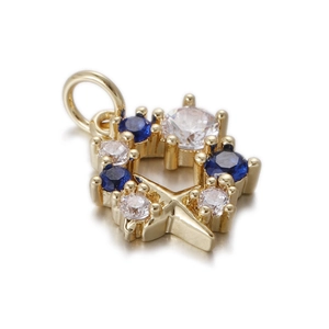 Detail of gold star pendant with blue sapphires and clear zircons in a prong setting