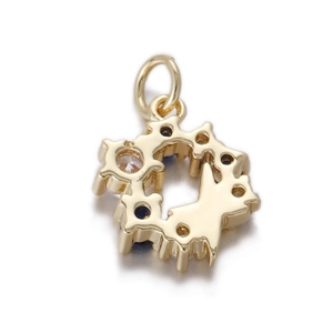 Detailed view of a gold-plated star pendant with central blue and white gemstones