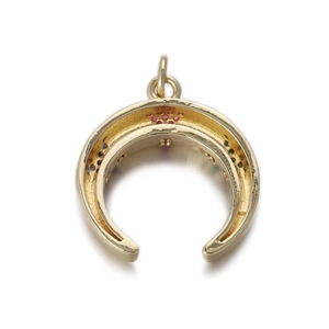 Detailed macro view of crescent moon pendant with colorful gemstones and golden finish