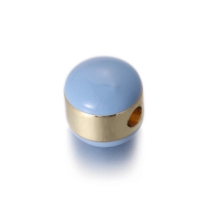 Macro shot of light blue enamel egg bead with a gold metal band for DIY jewelry