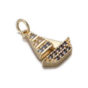 Close-up of gold geometric pendant with navy blue stones and micro-pave setting