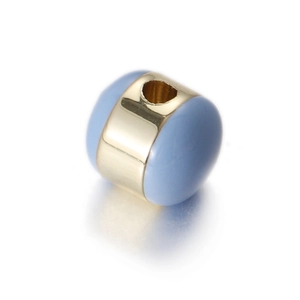 Macro detail of gold-plated egg-shaped charm with light blue enamel finish for DIY jewelry