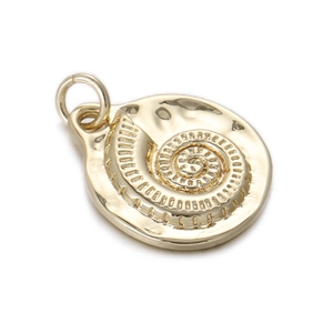 Macro shot of gold-plated brass pendant featuring a spiral nautilus design and hammered texture