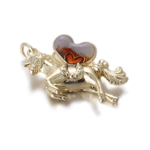Detailed macro view of a golden unicorn pendant featuring heart-shaped red resin inlay detail