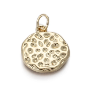 Detailed view of vintage gold hollowed-out textured medallion pendant with mounting ring