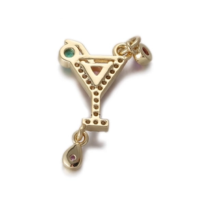 Detail of gold martini glass pendant with colorful gems and drop metal charm