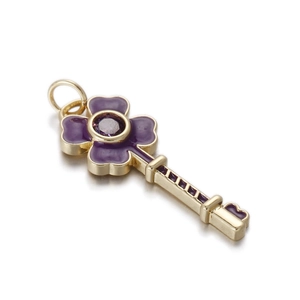 Detail of purple clover key pendant with gold metal plating and enamel inlay