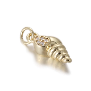 Detailed macro view of gold-plated conch shell pendant with white crystal accents