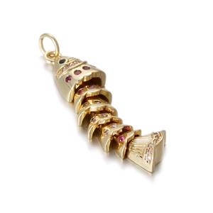 Detailed view of flexible articulated fish pendant with red and white crystal inlays
