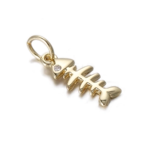 Detail view of a gold-plated fishbone pendant featuring a small white zircon stone