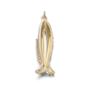 Macro shot of 14k gold fish-shaped pendant with polished finish and detailed outline