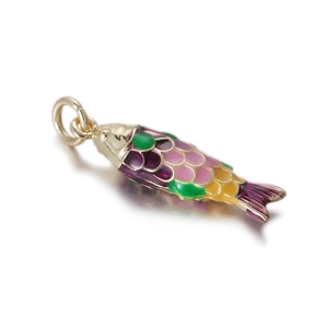 Macro detail of a colorful enamel koi fish pendant with a polished gold metal base