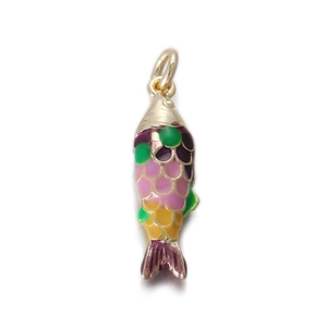 Macro shot of colorful enamel koi fish charm with gold plating for jewelry making