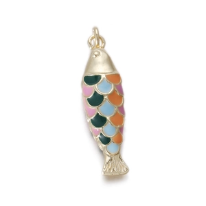 Detail of colorful fish charm with enamel scales and gold-plated finish for jewelry making